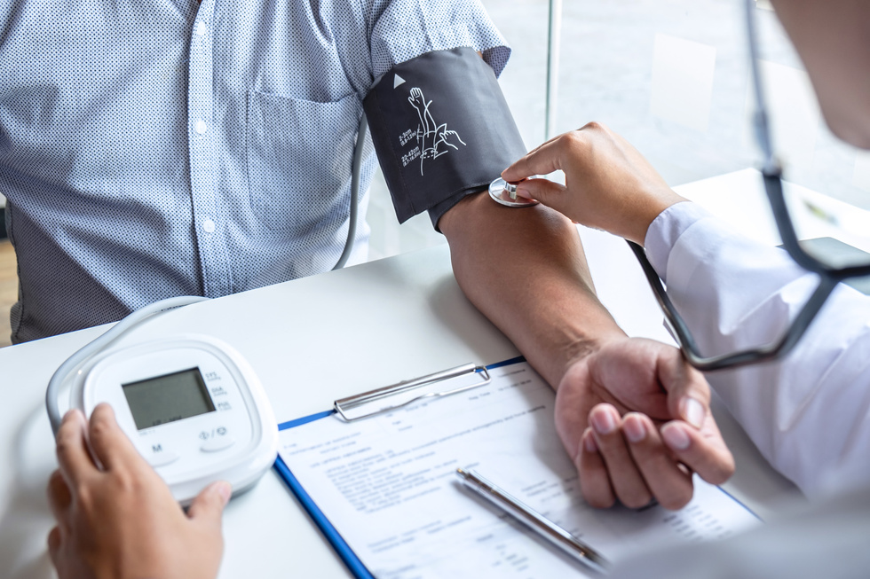 Doctor Checking Patient's Blood Pressure